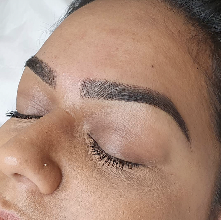 Image of a woman's eyebrow after being sculpted.
